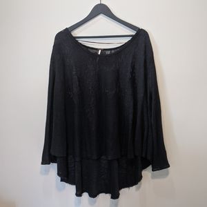 Free people oversize lace like material top.